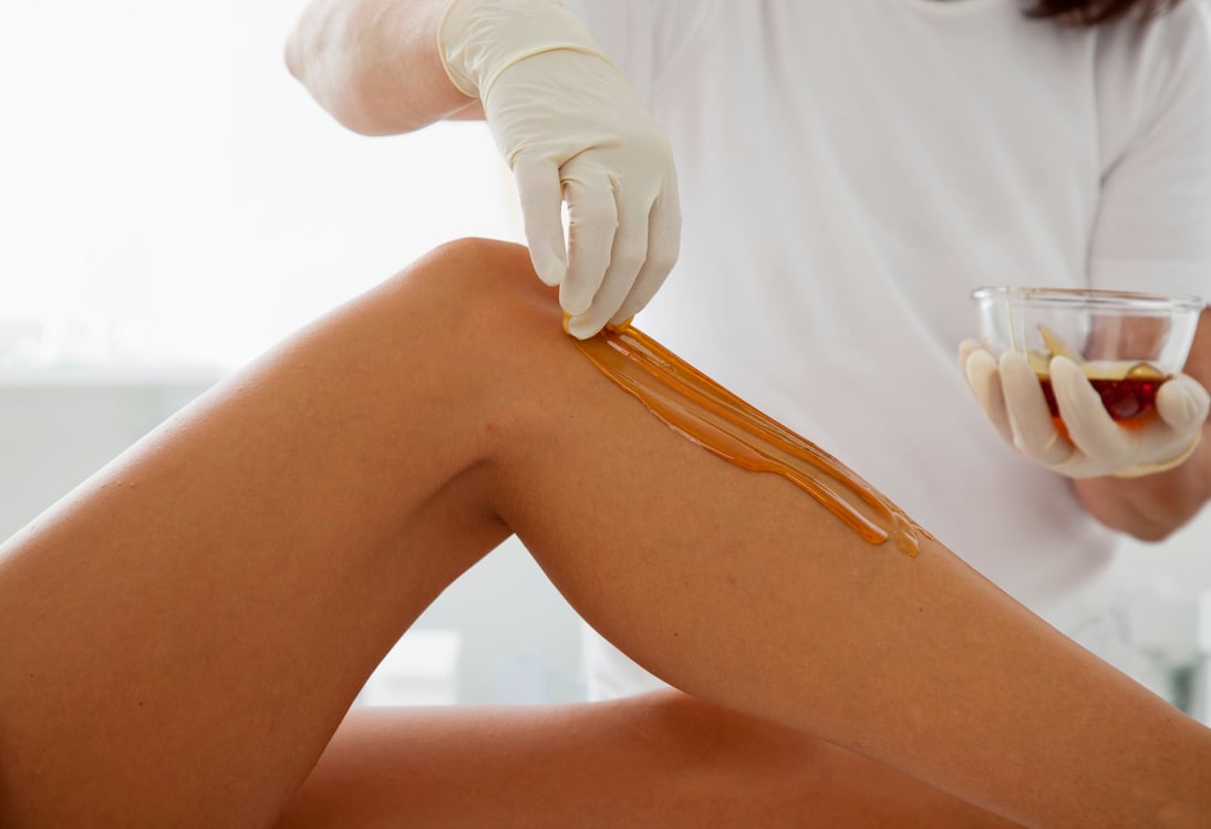 Woman Receiving a Waxing Treatment